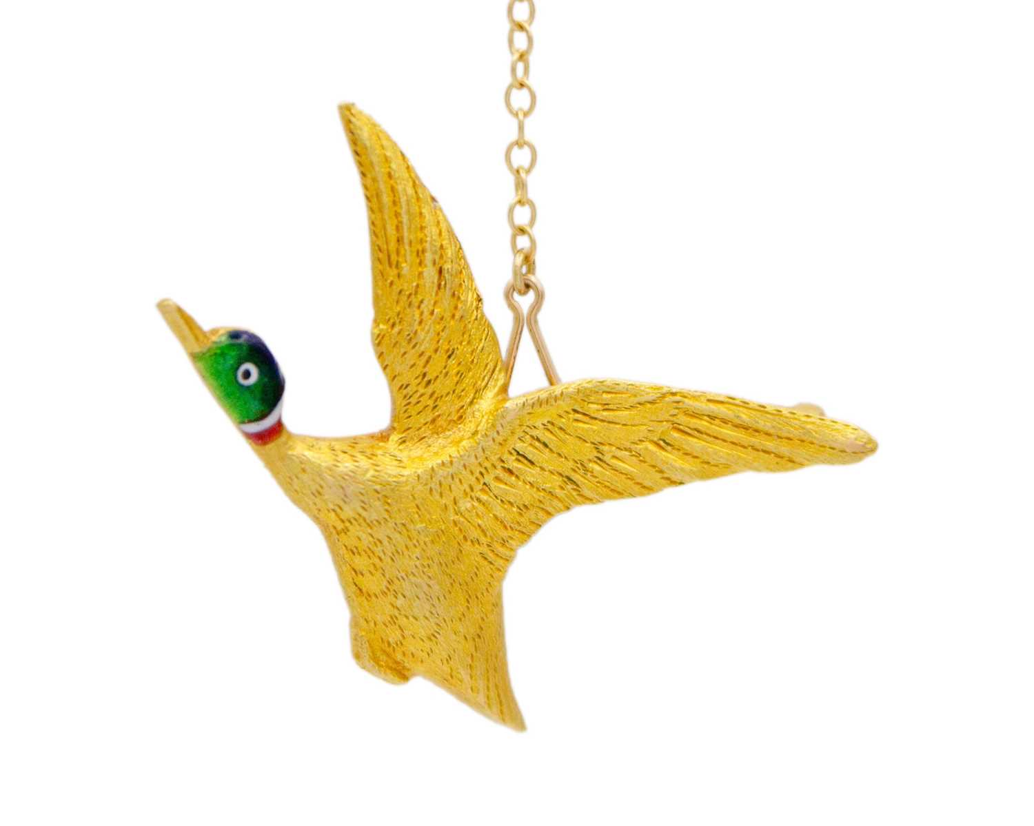 Lot 9 - An Edwardian 15ct gold and enamel brooch modeled as a flying Mallard duck.