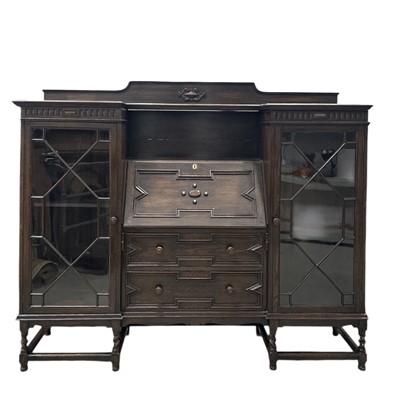 Lot 2 - An oak writing bureau flanked by two...