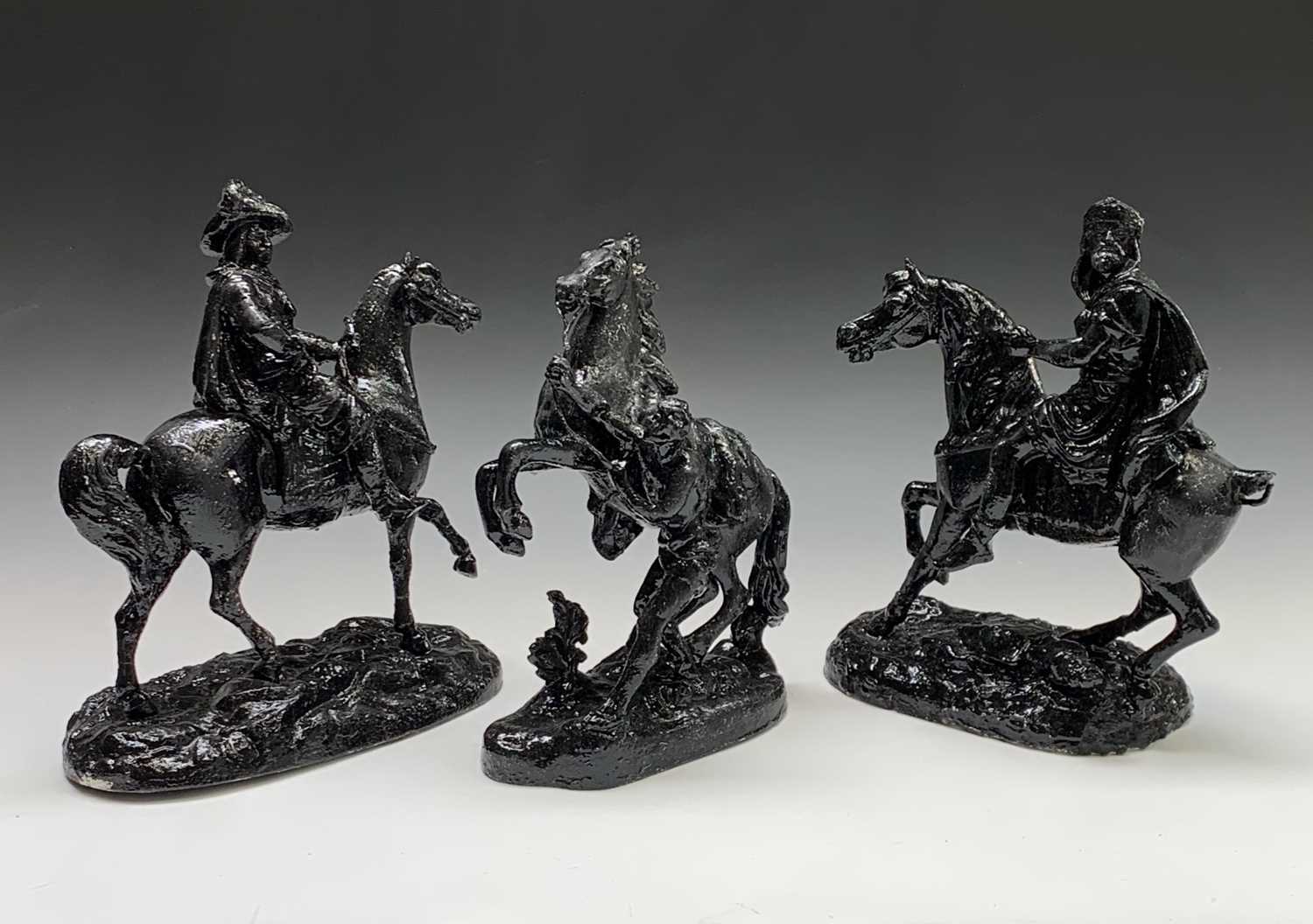 Lot 10 - A black painted spelter model of a Marly horse,...