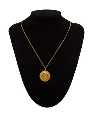 Lot 13 - GEORG JENSEN LTD - A 9k St Christopher pendant on a 9k curb-link 22" neck chain.