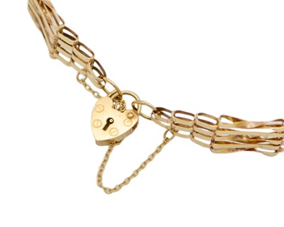 Lot 14 - A 9k hallmarked gold five-bar gate-link bracelet with padlock clasp.