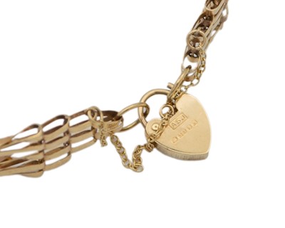Lot 14 - A 9k hallmarked gold five-bar gate-link bracelet with padlock clasp.