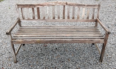 Lot 1 - An arched back hardwood garden bench. Height...