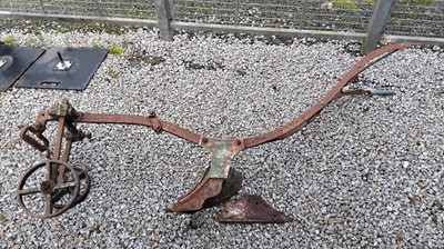 Lot 3 - A cast iron plough, by Howard, Bedford. Length...