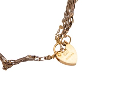 Lot 28 - A 9k five-bar gate bracelet with padlock clasp.