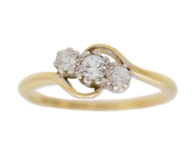 Lot 18 - An 18k and palladium white spinel set three-stone ring.