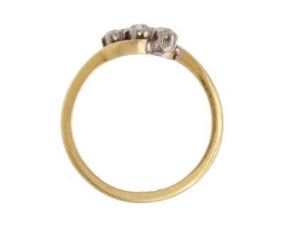 Lot 18 - An 18k and palladium white spinel set three-stone ring.