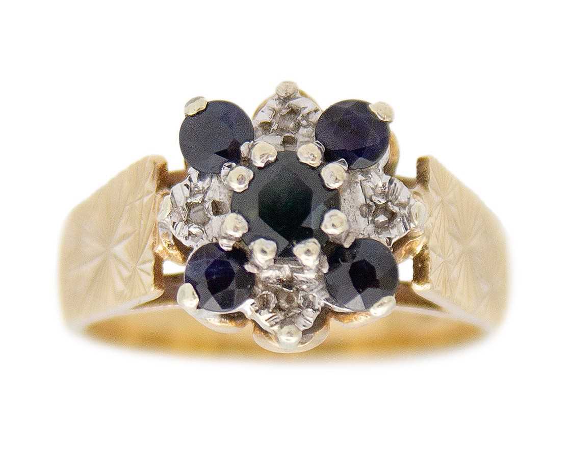 Lot 32 - A 9k blue sapphire and diamond set cluster ring.