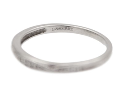 Lot 60 - A platinum diamond set band ring.