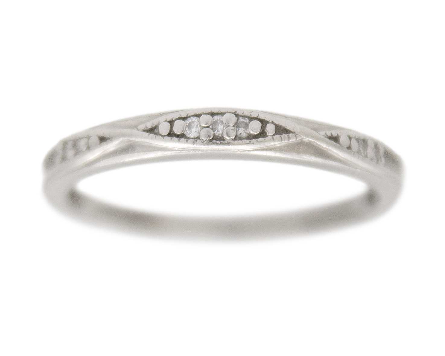 Lot 60 - A platinum diamond set band ring.