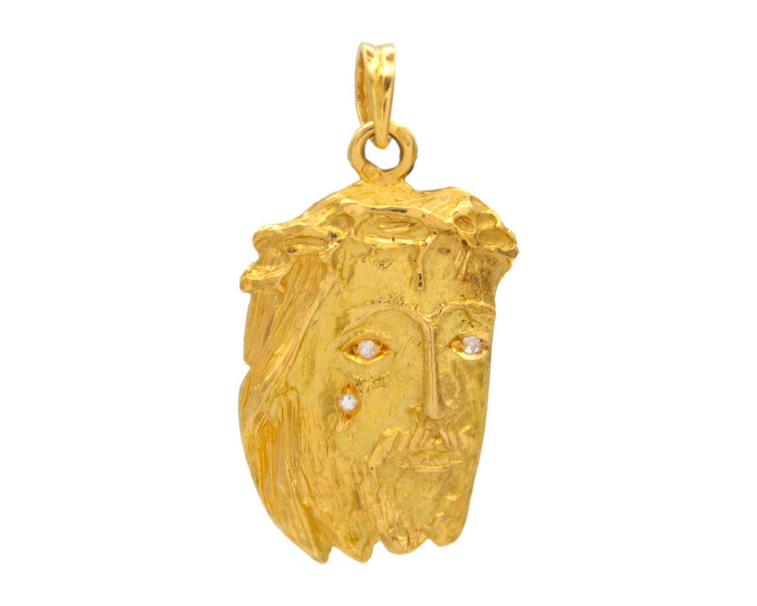 Lot 45 - A high purity gold diamond set pendant, cast as the head of Christ with thorns.