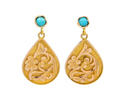 Lot 35 - A pair of Eastern gold turquoise set pendant stud earrings.