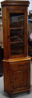 Lot 19 - A Pine Corner Display Cabinet. The Cabinet is...