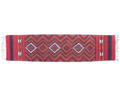 Lot 473 - A red kilim wool runner.