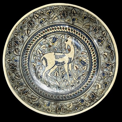 Lot 94 - A stoneware charger with hand-painted...