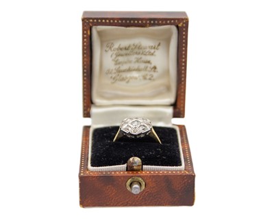 Lot 21 - An attractive Art Deco 18k and platinum diamond set ring.