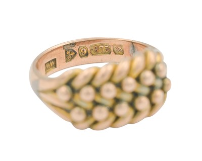 Lot 70 - An Edwardian 9k keeper ring.
