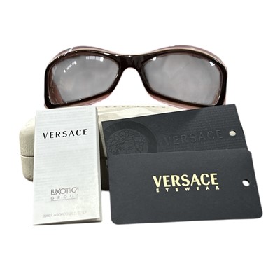 Lot 113 - A pair of Versace sunglasses.