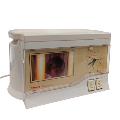 Lot 125 - A Swan Teasmade. It powers on, and the clock...