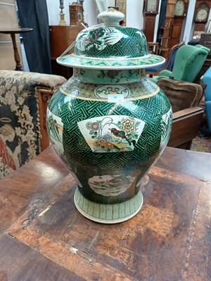 Lot 381 - A Famille Verte baluster vase and cover.