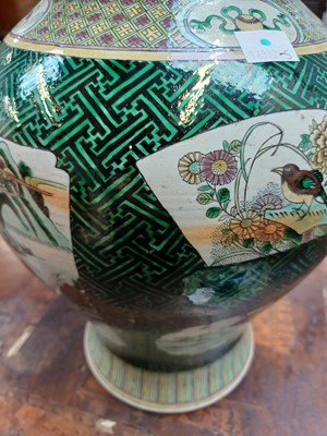 Lot 381 - A Famille Verte baluster vase and cover.
