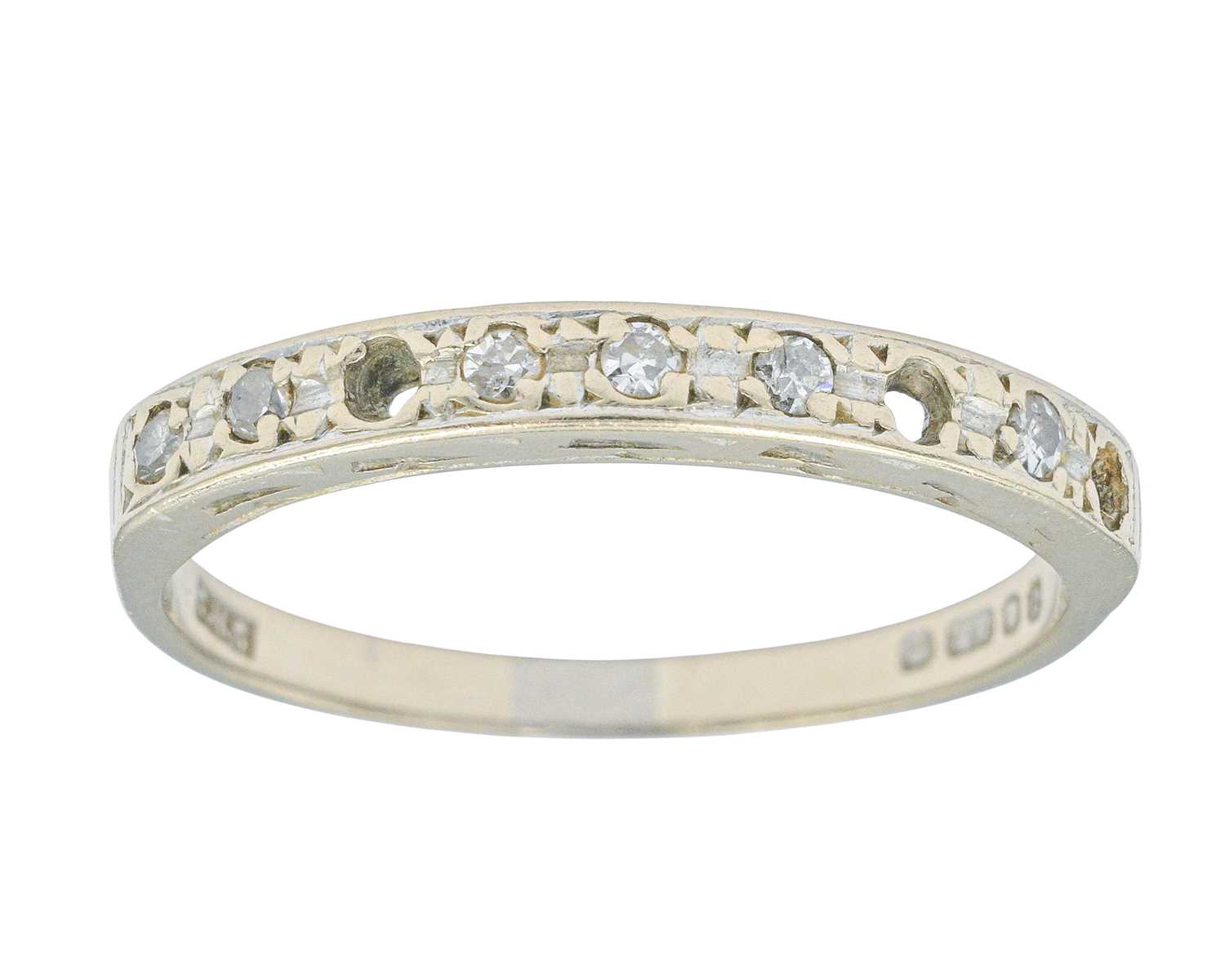Lot 62 - A modern 18k white gold diamond set half eternity ring.