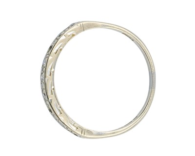 Lot 62 - A modern 18k white gold diamond set half eternity ring.