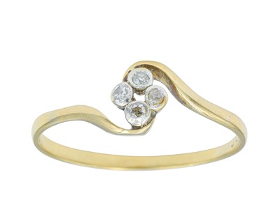 Lot 63 - An 18k diamond set four stone ring.