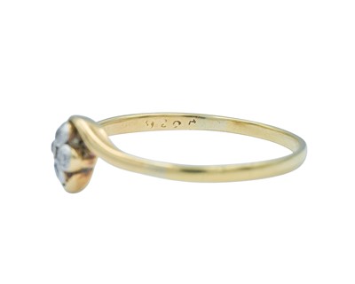 Lot 63 - An 18k diamond set four stone ring.