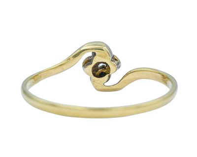 Lot 63 - An 18k diamond set four stone ring.