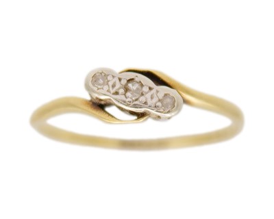 Lot 91 - An 18k and platinum diamond set three stone ring.