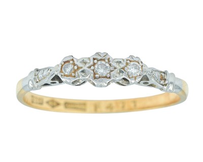 Lot 76 - An 18k and platinum diamond set three-stone ring.