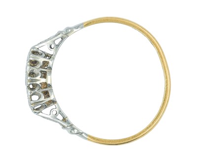 Lot 76 - An 18k and platinum diamond set three-stone ring.