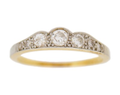Lot 98 - An early 20th century 18k and platinum, diamond set, seven stone half-hoop ring.