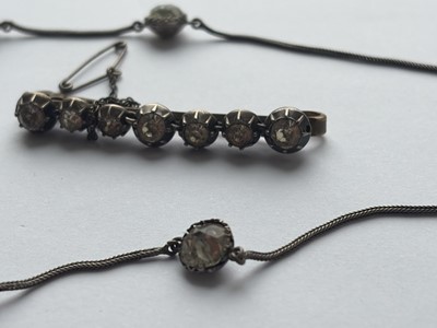 Lot 93 - A 19th-century cushion cut white paste set silver necklace, and a paste set brooch.