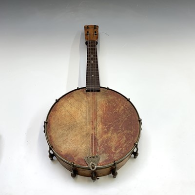 Lot 33 - A small fruitwood four string banjo ukelele,...