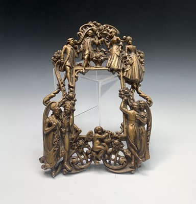 Lot 81 - An ornate brass photo frame, cast with dancing...