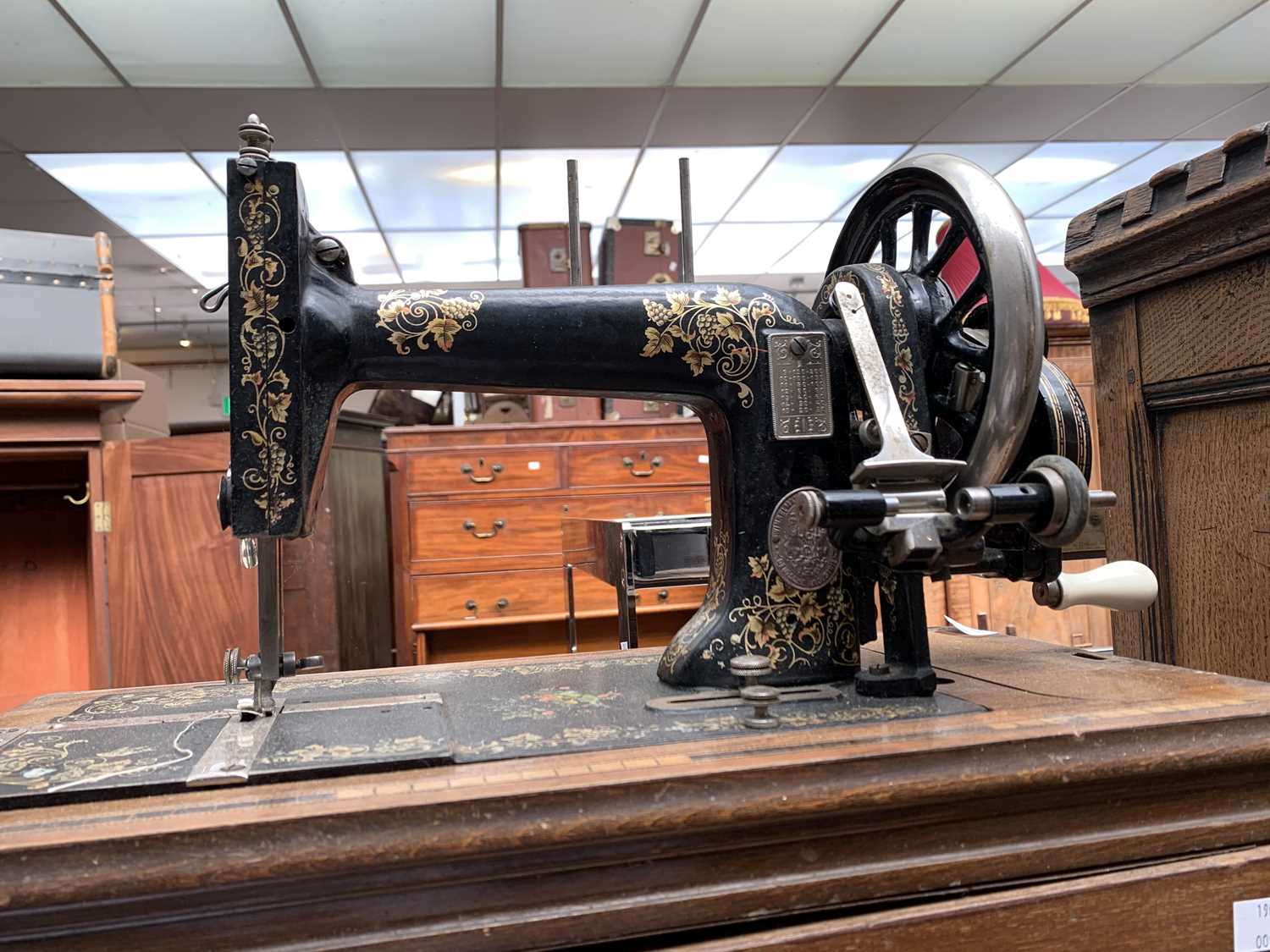 Lot 8 - A hand crank sewing machine by Winselmann, in...