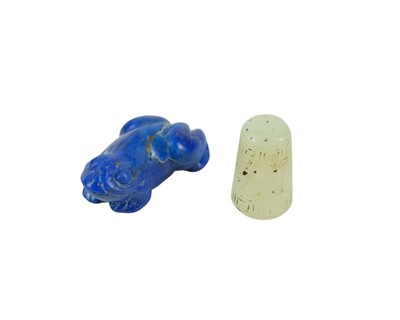 Lot 383 - A Chinese jade thimble.