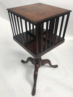 Lot 3017 - A mahogany revolving book stand, with leather...