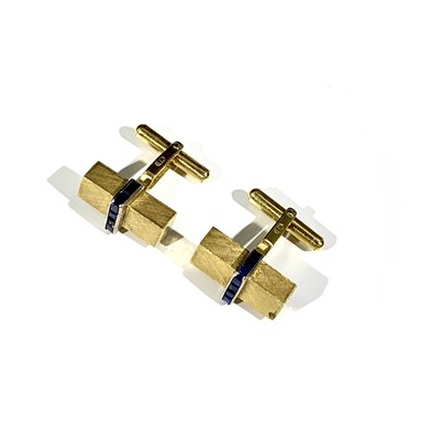 Lot 2362 - A pair of stylish 1950s gold cufflinks calibre...