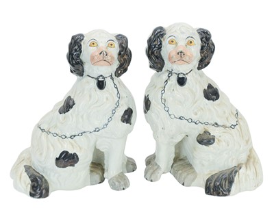 Lot 547 - A pair of Victorian Staffordshire pottery spaniels.