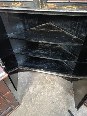 Lot 908 - A Japanned black lacquer standing corner cabinet.