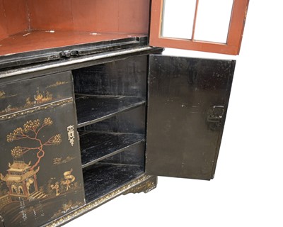 Lot 908 - A Japanned black lacquer standing corner cabinet.