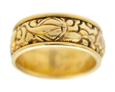 Lot 24 - A Good George IV high-purity gold band ring with carved decoration, with inscription dated 1824.