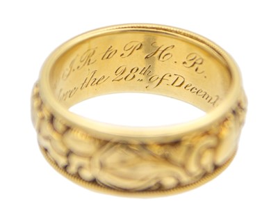 Lot 24 - A Good George IV high-purity gold band ring with carved decoration, with inscription dated 1824.