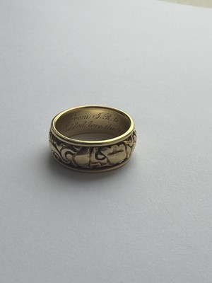 Lot 24 - A Good George IV high-purity gold band ring with carved decoration, with inscription dated 1824.