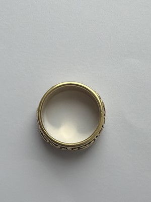 Lot 24 - A Good George IV high-purity gold band ring with carved decoration, with inscription dated 1824.