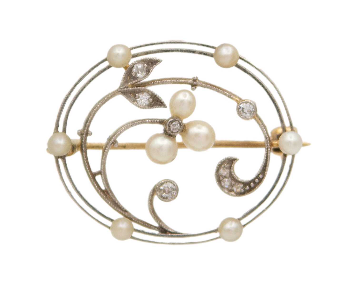 Lot 49 - A Belle Epoque diamond and seed pearl set gold and platinum open-work brooch.