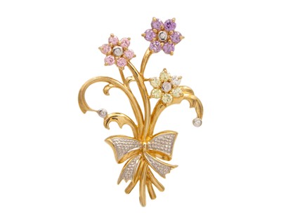 Lot 51 - A 9k CZ set ribbon and foliate spray design brooch.